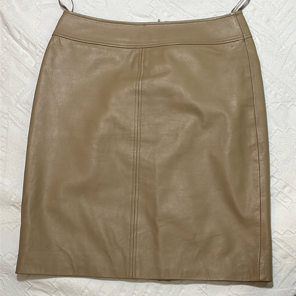 River Island 100% Leather Skirt Camel/Tan 
Polyester lining Size 12